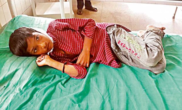 Dalit boy Santosh in hospital after a temple priest smashed his head against a pillar Dalit boy Santosh in hospital after a temple priest smashed his head against a pillar